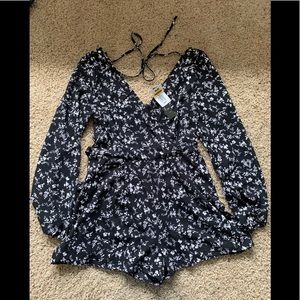 Kohl’s Trixx women’s black and white floral long-sleeved romper with tie waist